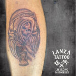 Black and grey Grim Reaper tattoo, created at Lanza Tattoo in Puerto del Carmen.