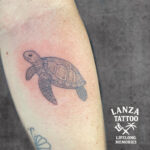 Black and grey sea turtle tattoo, created at Lanza Tattoo in Puerto del Carmen.