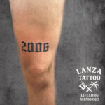 Blackwork number tattoo, created at Lanza Tattoo in Puerto del Carmen.