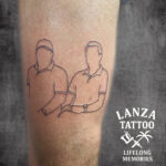 Minimalist fine line portrait tattoo, created at Lanza Tattoo in Puerto del Carmen.
